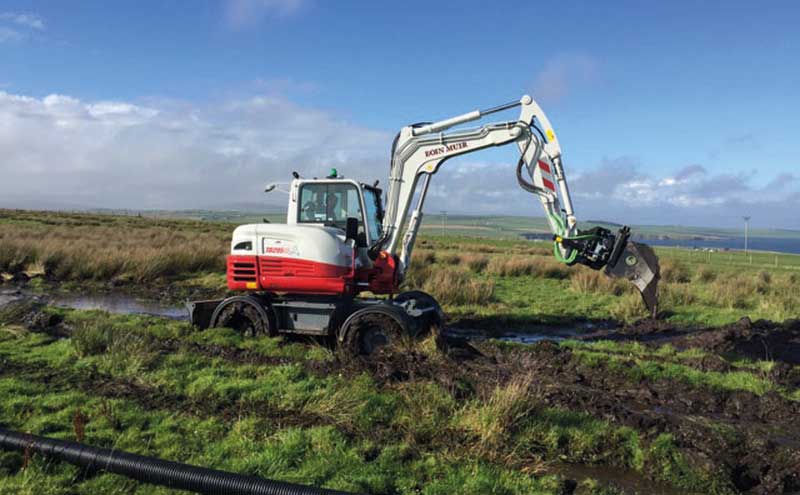 Digger in field