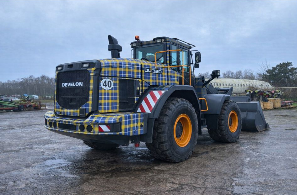 Loading shovel in Doddie Weir tartan